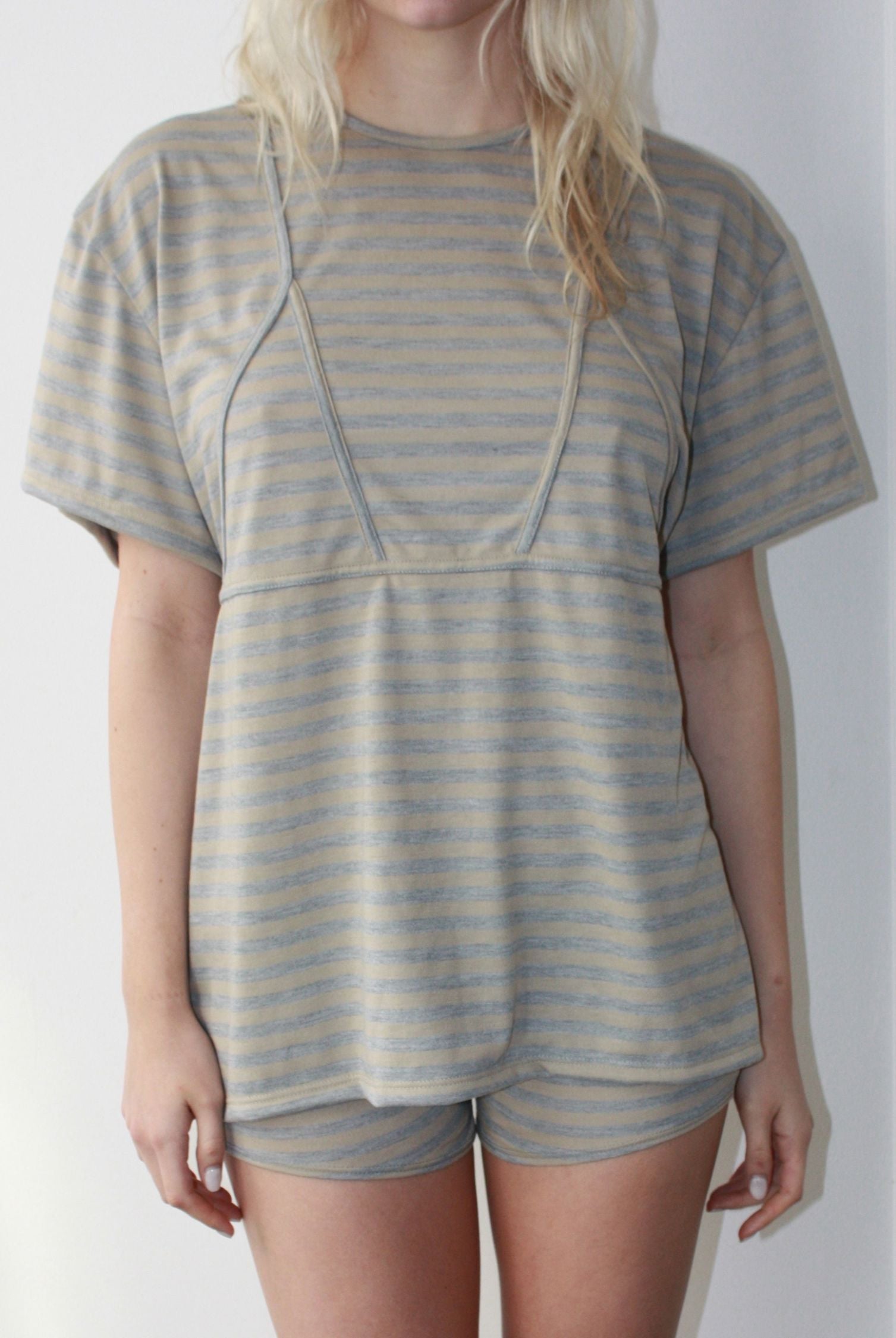 Oversize cotton t shirt with beige and blue stipes featuring a babydoll cut and flare as well as a delicate bikini top detailing.